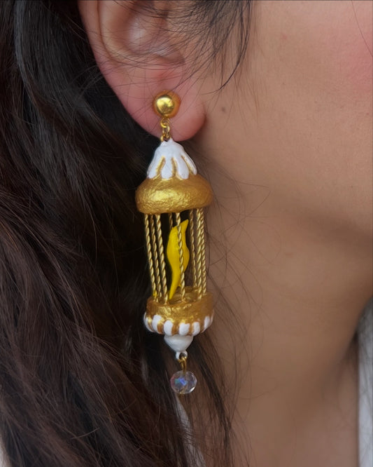 Yellow bird in a golden cage dangler