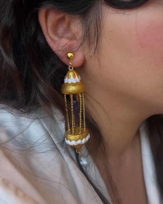 Purple bird in golden cage dangler