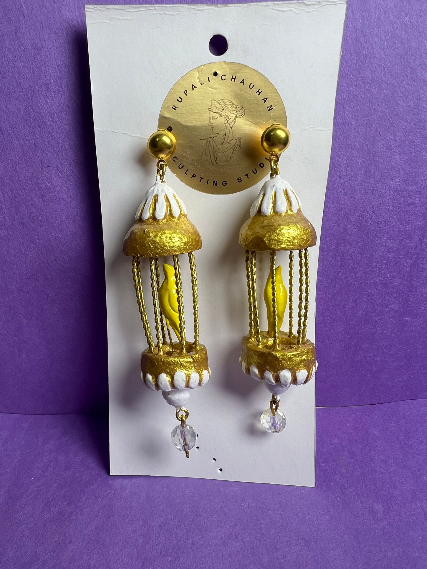 Yellow bird in a golden cage dangler