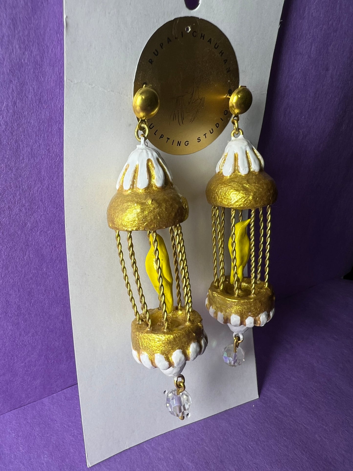 Yellow bird in a golden cage dangler