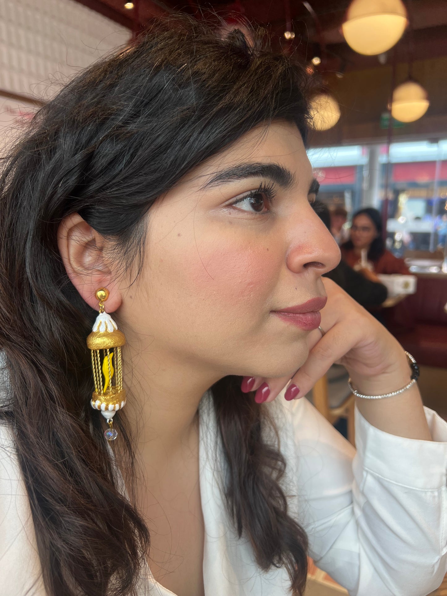 Yellow bird in a golden cage dangler